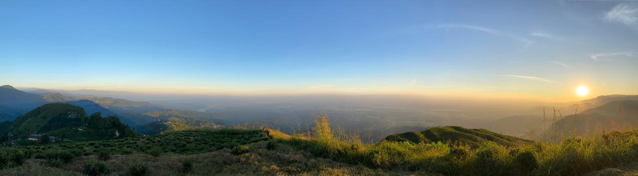 A hilltop view of Sunset over the hills of Darjeeling