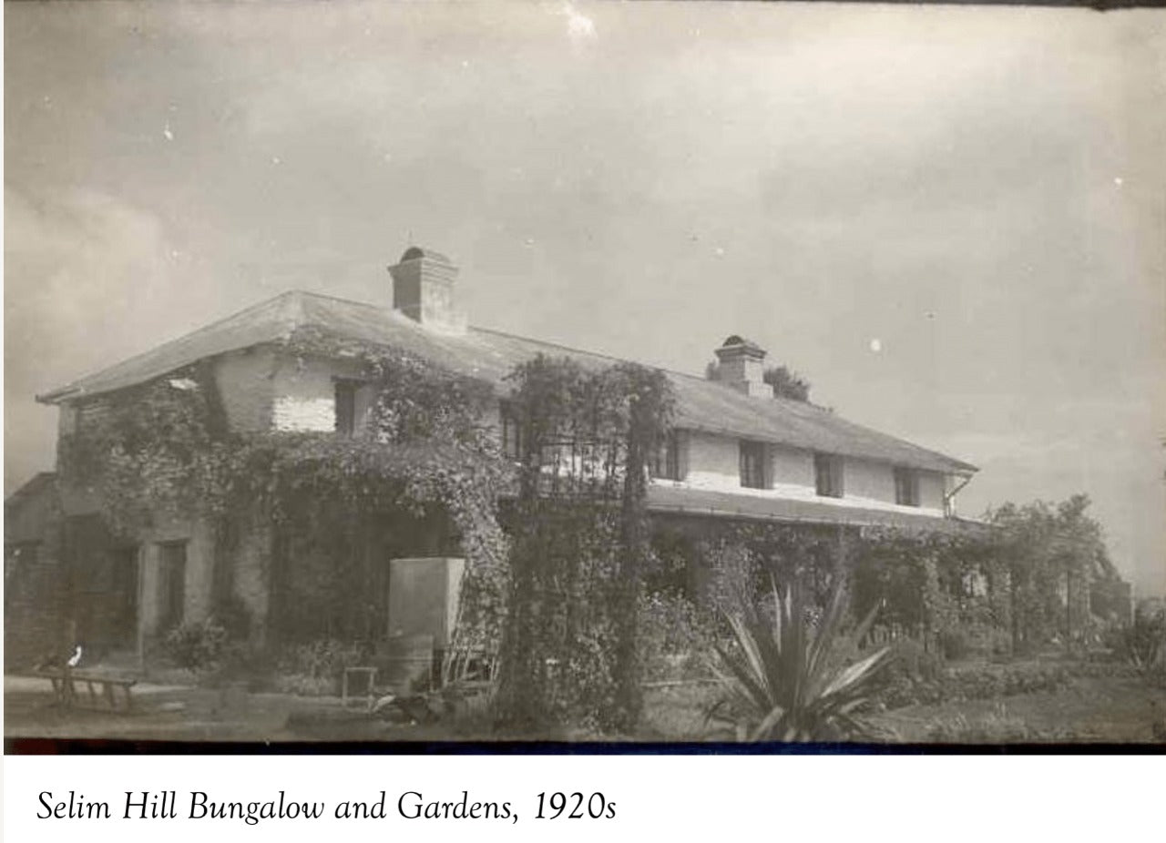 A black and white photograph of a tea garden bungalow in Darjeeling in the 1920s